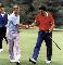 Dean Smith and Jimmy V share a handshake after a round of golf