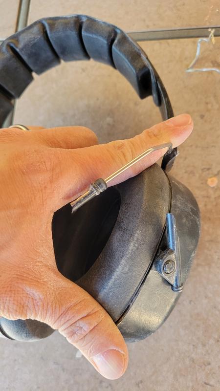 Closer view of broken spindly thing that attaches to the earmuff.