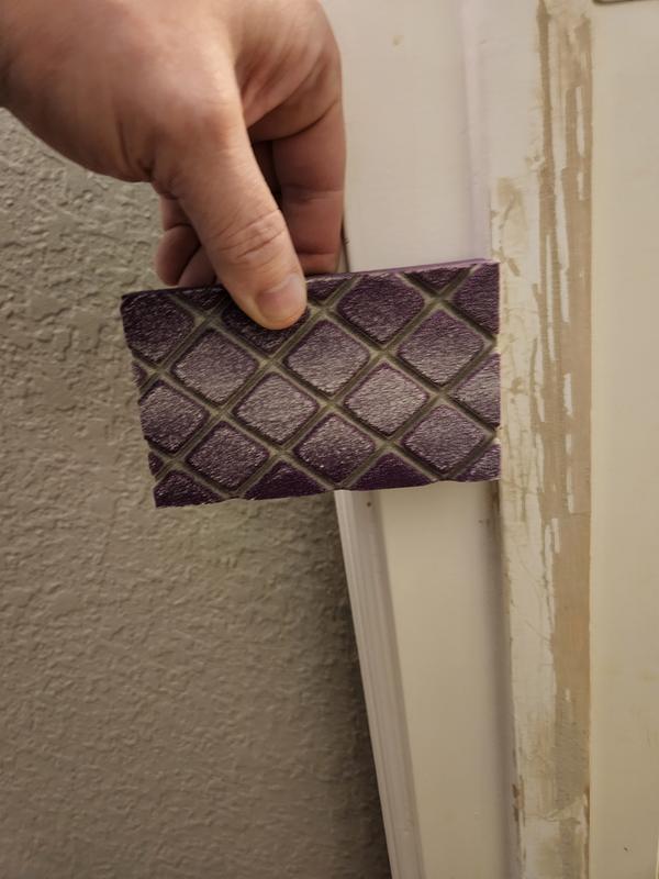 Sanding wood filler on door jam to fix dog scratches