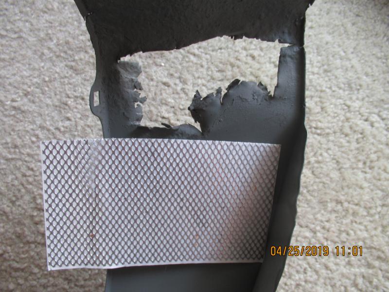 before the square cut of rusted metal