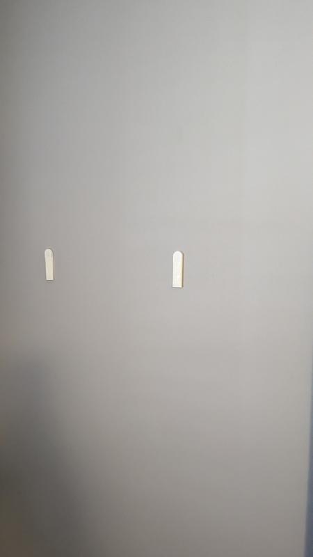 Weight is less than 2 pounds.  2 velcros and 2 adhesives failed.  Bad product.