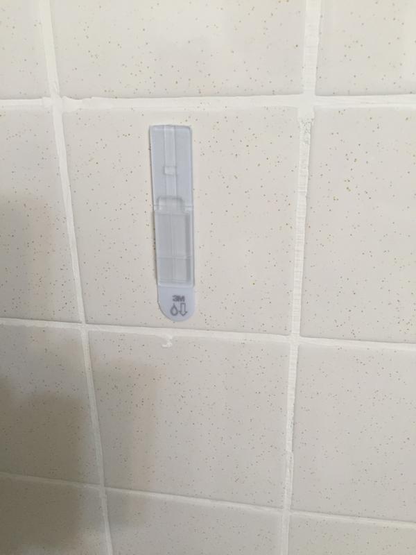 Apply adhesive as directed. Then allow to adhere 24 hours after first shower.