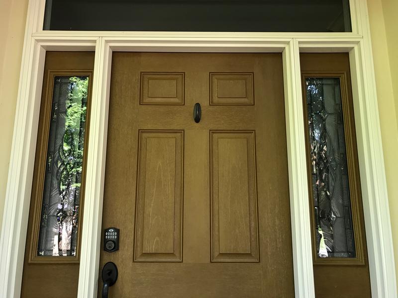 Bronze-colored Command hook matches door hardware when no wreath is hung.