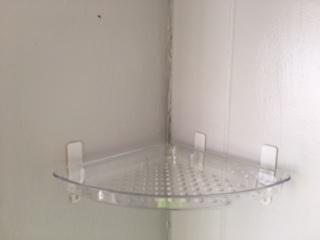 Plastic corner shelf to support a security camera