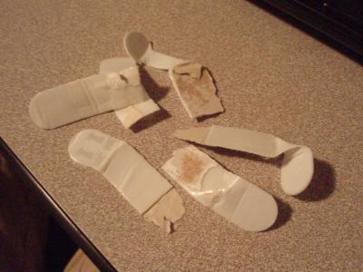 3M strips with paint, primer, and drywall stuck to them