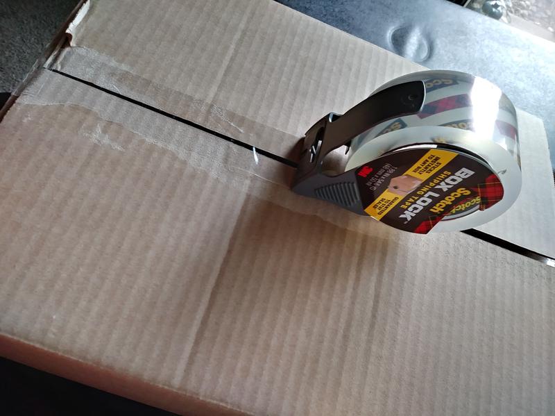 Sticks even to torn boxes!