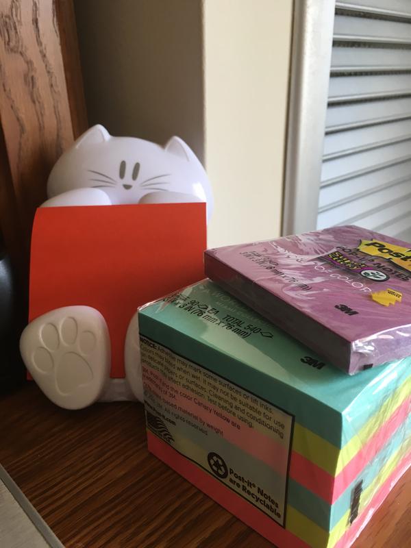 My cat dispenser and my pads of post-it pop-up notes