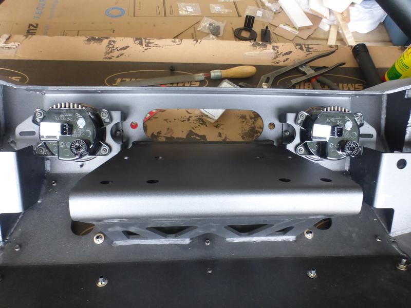 Fog lights relative to winch mounting plate.