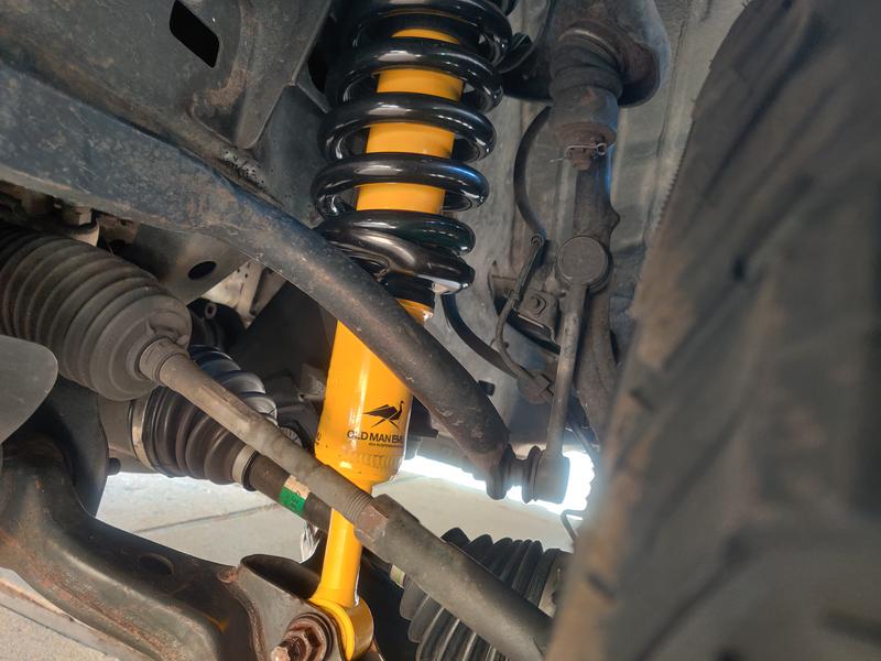 Driverside front l, don't forget that's where your trim packer spacer goes. Slide the spacer down on the shock under the spring plate to compensate for the Taco lean.