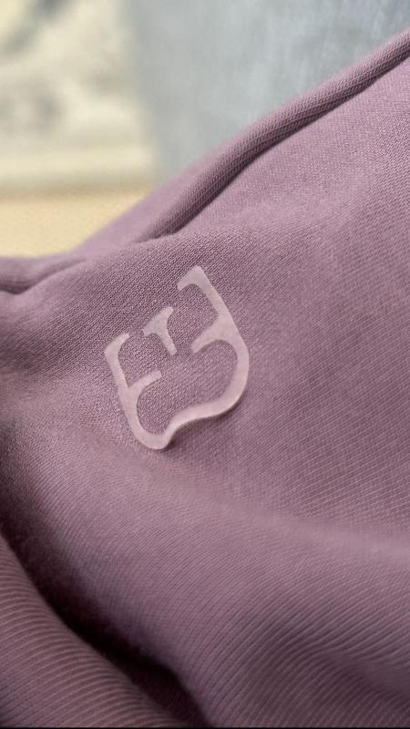 Customer photo for "Logo peeling off after one wash"