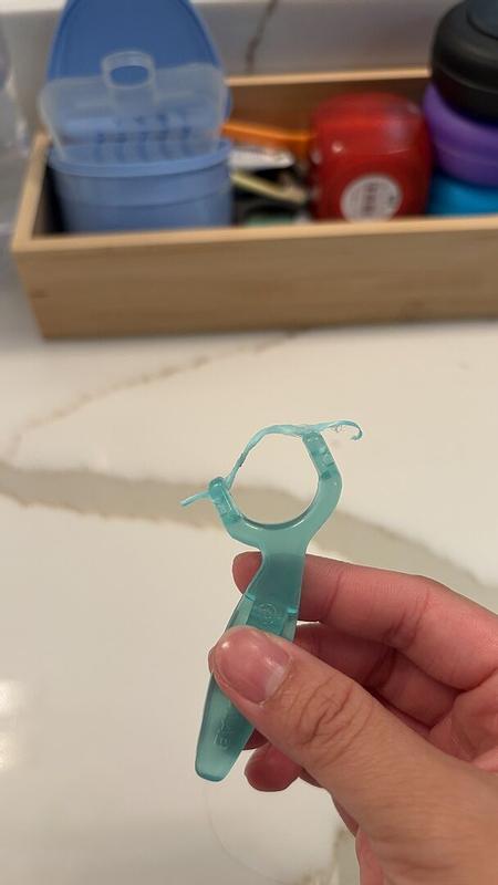 Customer photo for "Cute concept but floss doesn’t stay in"