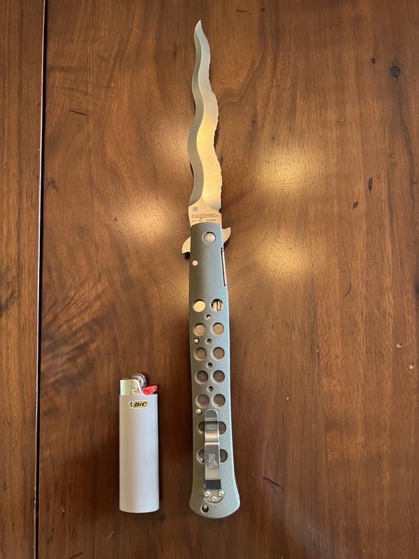 CS Ti-Lite Kris Serrated with Bic lighter for size comparison.