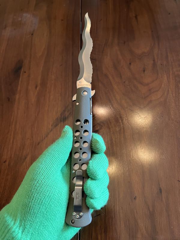 CS Ti-Lite Kris Serrated with box. This blade, while a small sword, haha, handles wonderfully.