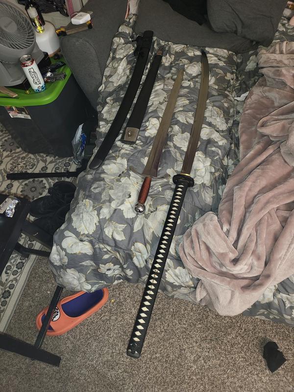 Huge sword. Next to it is an arming sword.