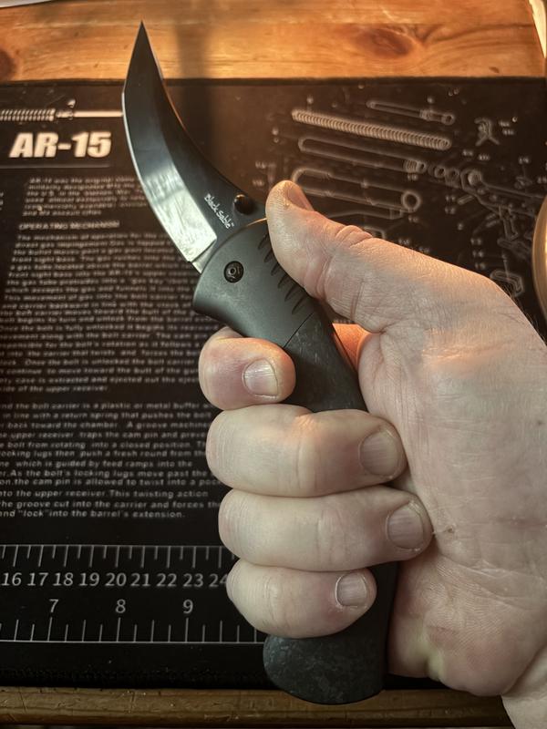 Curved handle cradles my hand.