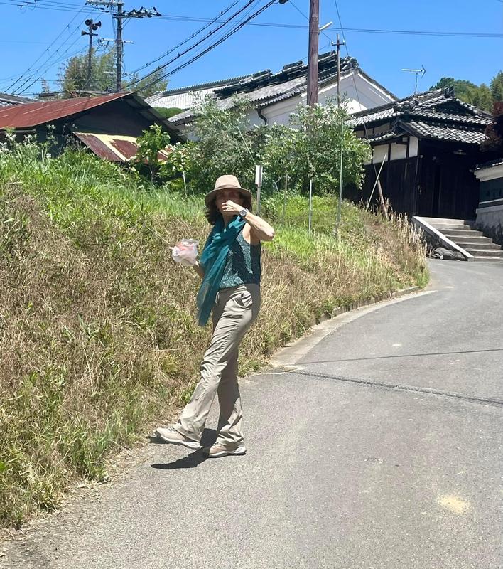 In Japan eating strawberries (and biking) wearing favorite Columbia pants and boots.