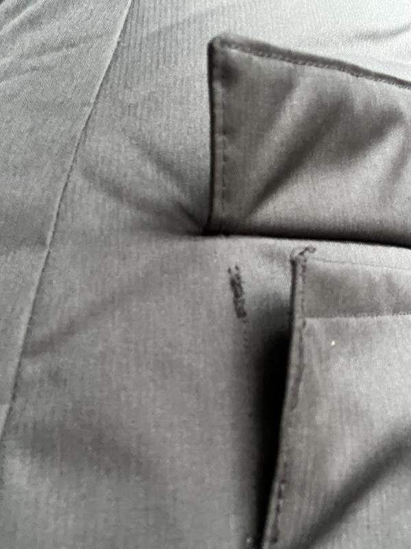 Very thin thread, only a single line of stitching. For a winter coat this is very low grade of work.