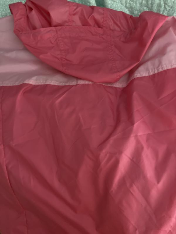 The material is soft and lightweight, perfect for a windy or misty day.