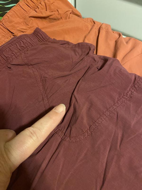 The burnt orange and burgundy shorts both have bunching at the pocket. That’s not from being wrinkled. Made in Indonesia