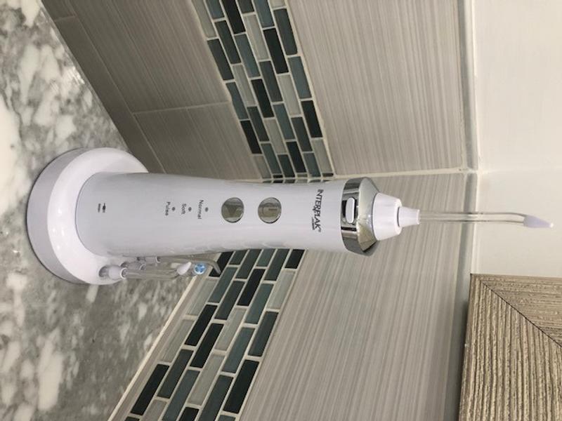 Interplak on base on my bathroom counter