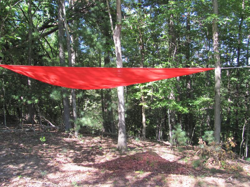 We tied the party shade between trees with the ropes provided and the grommets in the material made it super easy.
