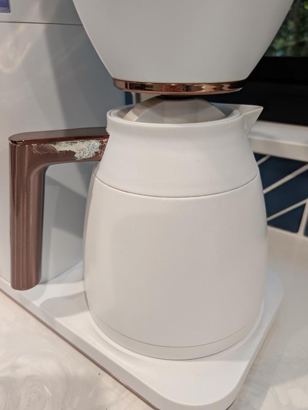 Lights out on the clock and a peeling handle on the carafe