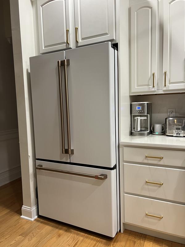 European counter depth bottom freezer refrigerator with stainless steel  doors, platinum cabinet, factory installed icemaker, and digital controls  for each section 