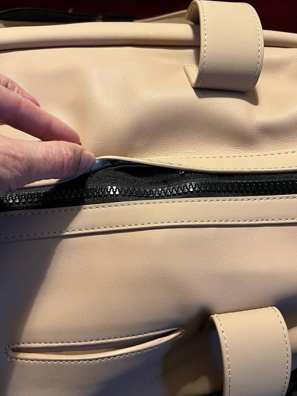Customer photo for "Quality control needed on the zippers."