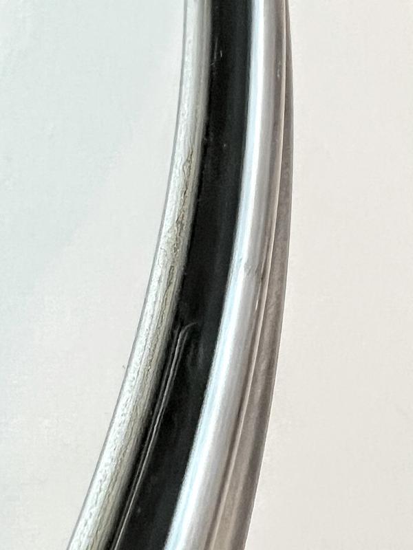 Liquid trapped inside seal of lid.