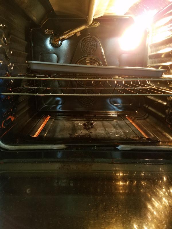 Baking a now lopsided pizza