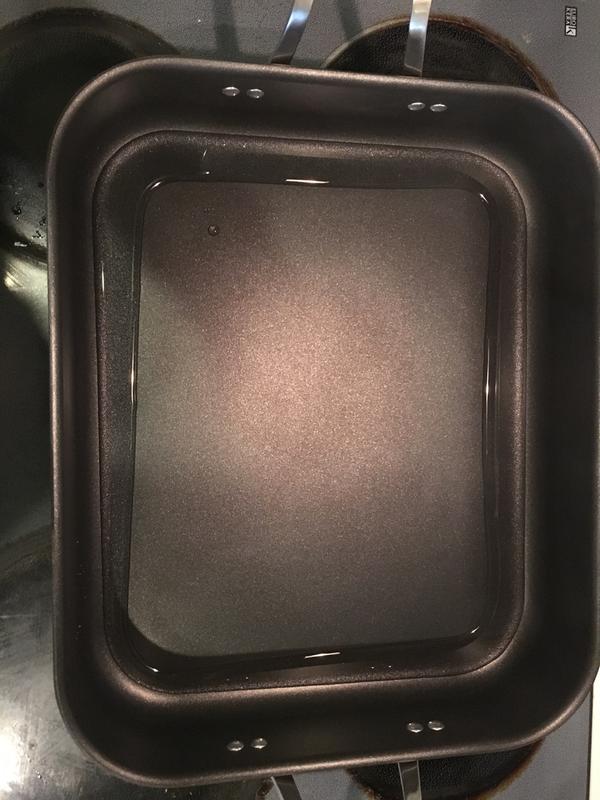 a few ounces of water poured into the pan illustrate the trough and raised pan bottom.