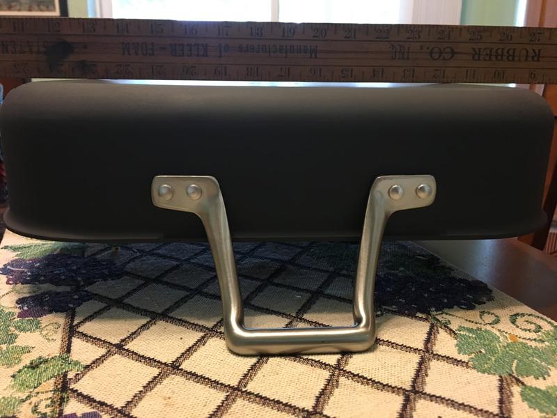 Straigh edge laid across pan bottom shows elevated center.