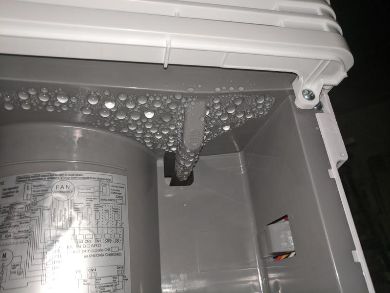 This is the view with the drain bucket removed - this is where you can connect plastic tubing that diverts condensate to the drain hose at the back of the unit.