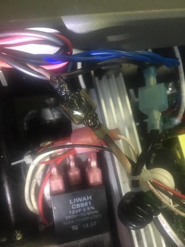 Burned wire under treadmill cover.