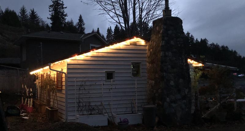 Outdoor extension cord is being used behind the chimney ( roof ) tk save lights then the next string is connected.