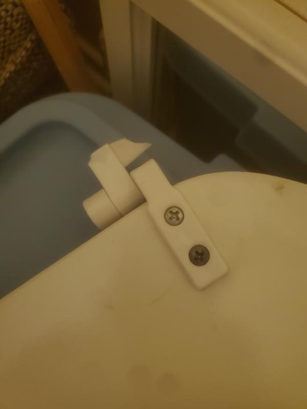 Two broken toilet seats