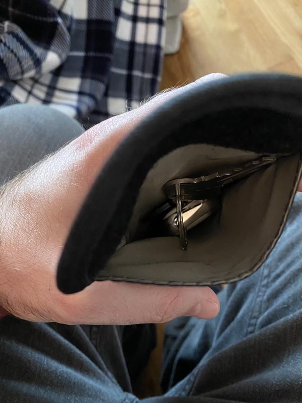 The rear, metal lined pocket.