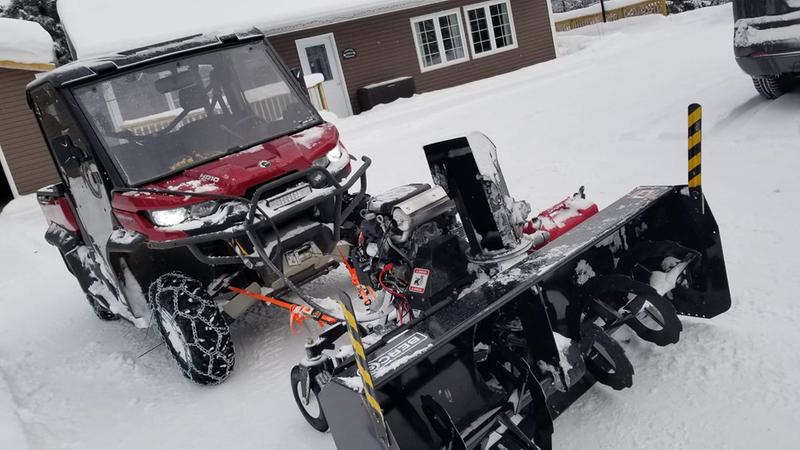Straps instead of chains for securing blower against sideways shift