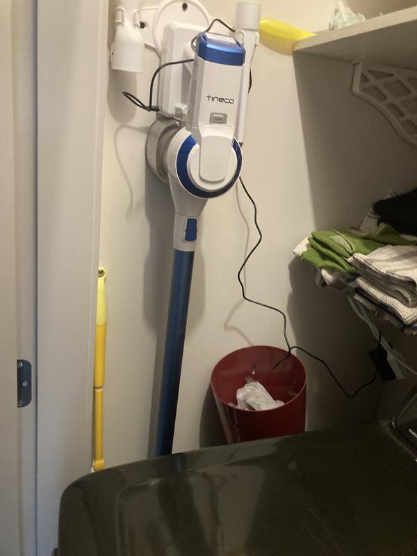 Tucked neatly beside our dryer, for easy quick access.