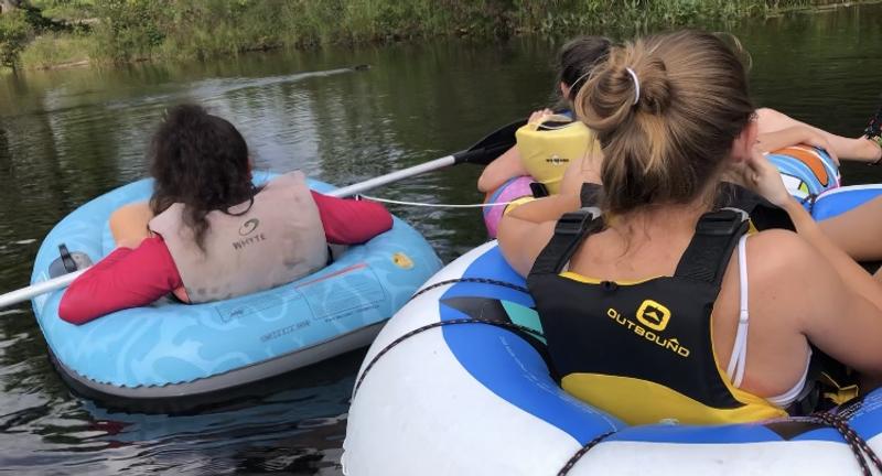 Keeping the floaties tied together with this rope when going down river (this was the slow part but it worked in the slight rapids, too).