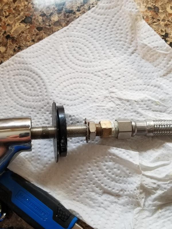 faucet underside with included adapter connected to braided hose