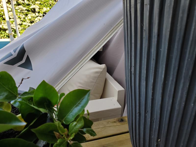 One side is draped on the back of the sofa.