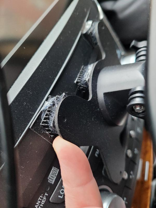 Small velcro pieces holding screen.