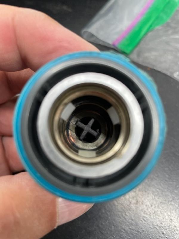 Center plastic worn on sides thus not holding valve open