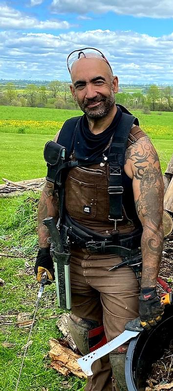 "Tool Nerd" (mattock on belt behind left hand)