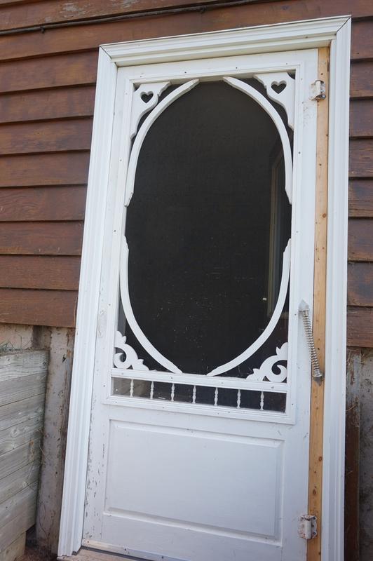 Screen door closure spring