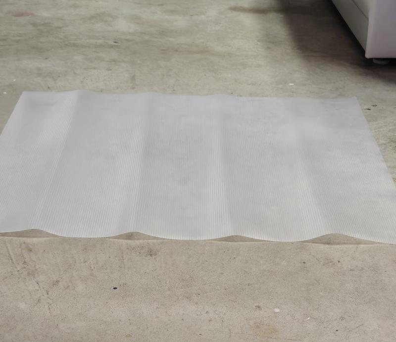 Trimmed Mat on Floor - Note the Fold Lines .