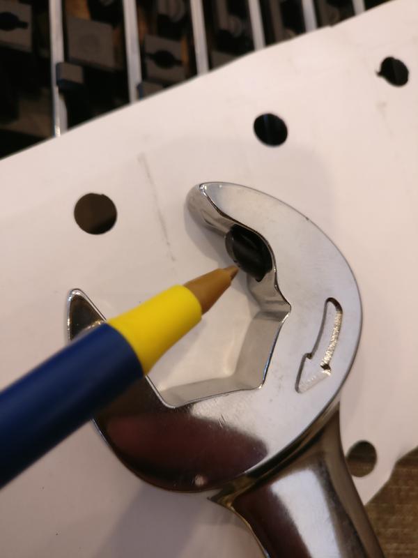 Ratcheting mechanism on the open end of the wrench.
