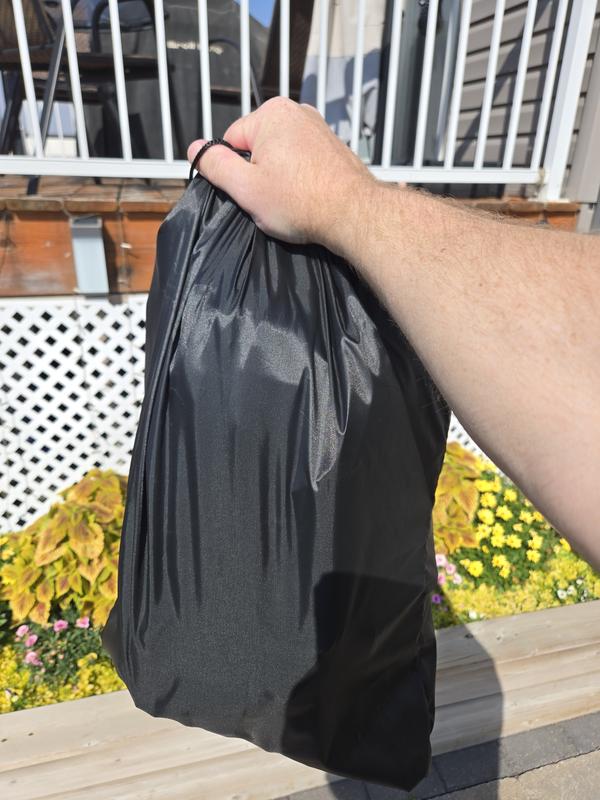 Cargo bag folded up in provided storage bag