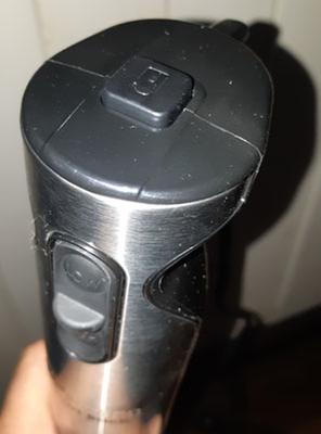 Lock Button on top requires two handed operation.